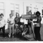 Ron Jackson, directly left of sign, at a methadone clinic in Corpus Christi, TX