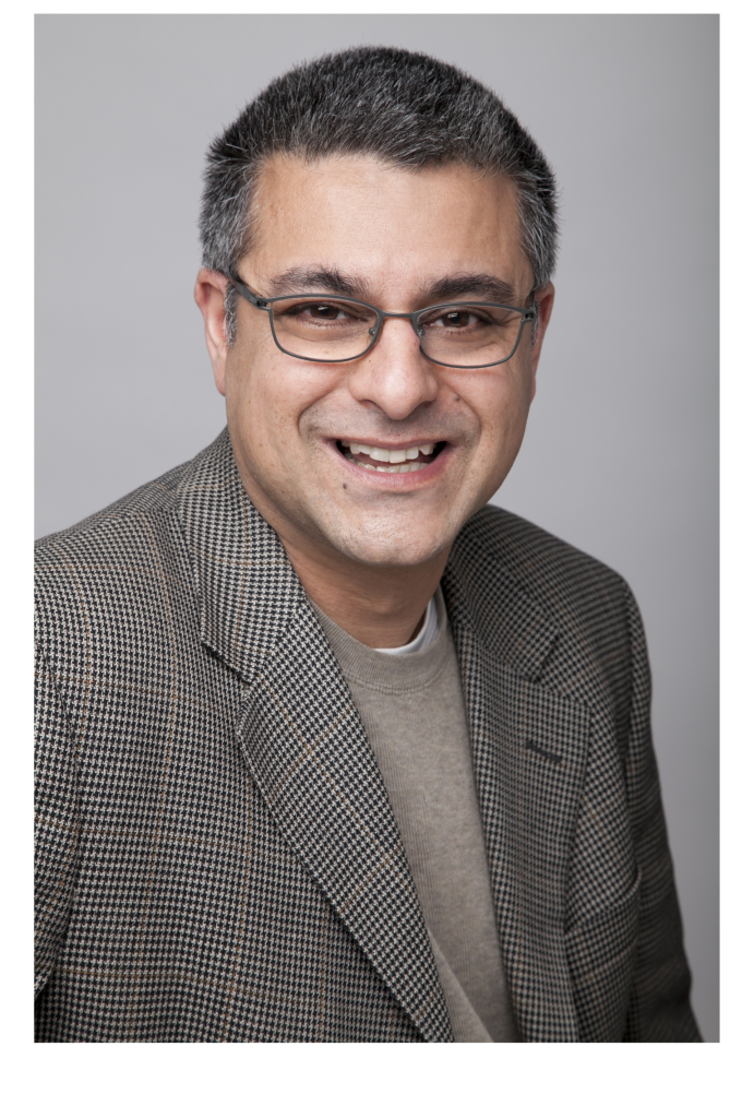 Sandeep Kaushik smiles and looks into the camera